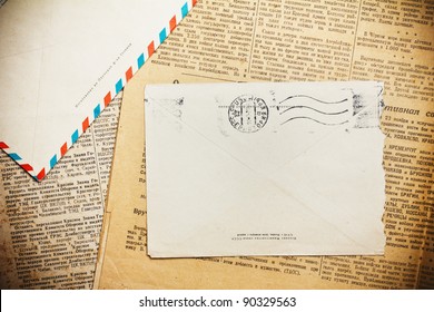 Vintage Envelope On Aged Newspaper
