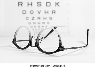 Vintage Eye Glasses With Eye Chart Isolated On White