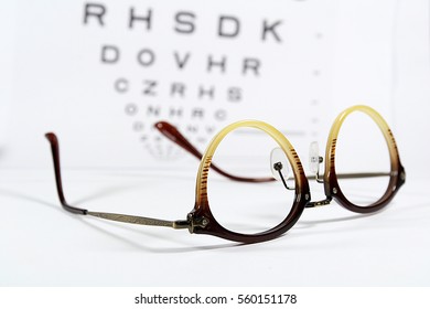 Vintage Eye Glasses With Eye Chart Isolated On White