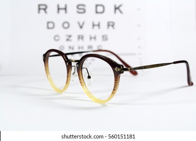 Vintage Eye Glasses With Eye Chart Isolated On White