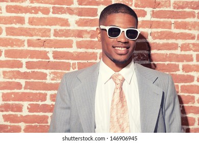 Vintage Fashion Cool Afro American Groom With Sunglasses Against Old Brick Wall. Urban Environment.