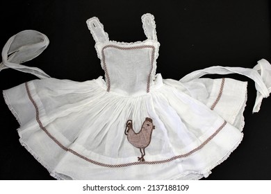 Vintage Fashion Handmade 1950s Sheer White Organdy Dress Apron With Chicken Applique And Brown And White Gingham Trim.