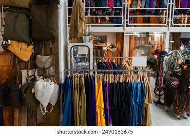 A lot of vintage and fashionable clothes in a second-hand store for recycling or resale to preserve the environment - Powered by Shutterstock