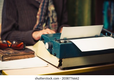 Vintage female writer reporter working behind his desk - Shutterstock ID 2038776662