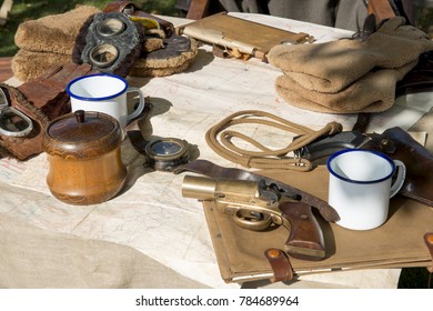 Vintage Fighter Pilot's Gear On Map Spread Across Table