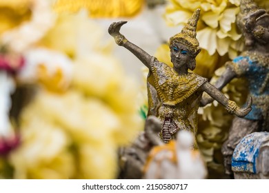 Vintage figurine of traditional Thai ceremonial dancer in temple Thailand