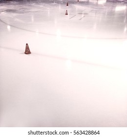 Vintage Filtered Image Of An Ice Skating Rink With Ice Hockey Markings, Lines And Face Off Circle With Cones