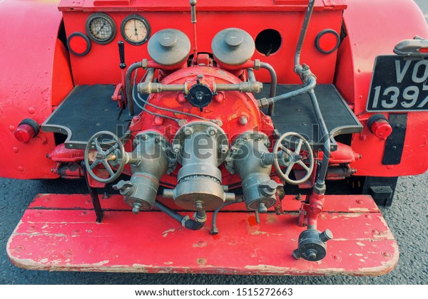 Vintage fire and rescue equipment. A detailed\
photo of aged  equipment closeup on a  red wooden fire truck\
.Moscow,Russia,Sept\
2019\
