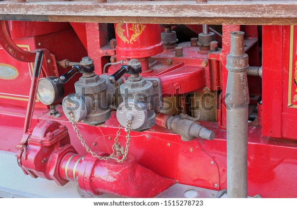 Vintage fire and rescue equipment. A detailed photo\
of aged  equipment closeup on a  red wooden fire truck\
.Moscow,Russia,Sept\
2019
