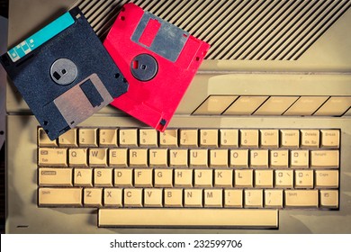 Vintage floppy disks and keyboard