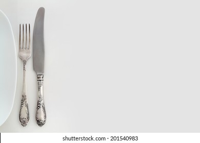 Vintage Fork And Knife Near The Plate. Background With Free Text Space. Overhead View. 