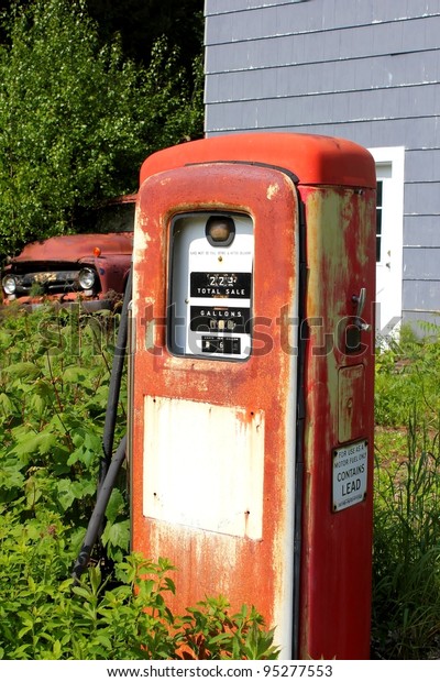 vintage gas
pump and truck at an abandoned
location