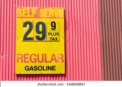 Vintage Gas Station Price Sign Advertising Pre-inflation Low Regular Gasoline Prices On The Barn Wall