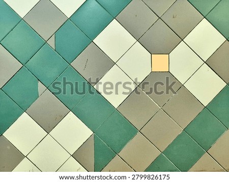 Vintage geometric ceramic tile pattern background with green and beige diamond shapes