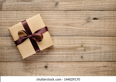 Vintage Gift Box With Bow On Wooden Background