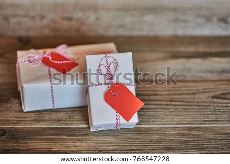 Image, Stock Photo White gift box with label on wooden table.