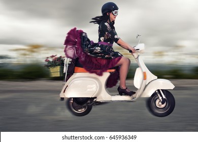 girl riding vespa scooter