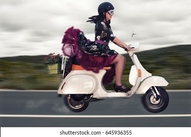 girl riding vespa scooter