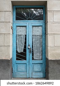 Vintage Glass Door With Blue Paint Chip And Old Curtains