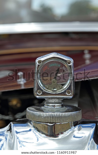 Vintage glass\
temperature gauge on a 1931 Singer Junior 8HP car. Barton, Devon,\
England. Photo taken 11 July\
2010.