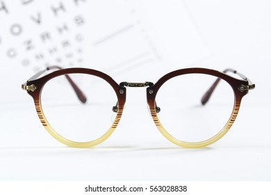 Vintage Glasses With Eye Chart Exam On White Background