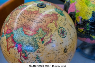 Vintage globe pointed to Asia and the former USSR (now Russia with China, India and Japan visible.  Found in an antique store.  geopolitical boarders