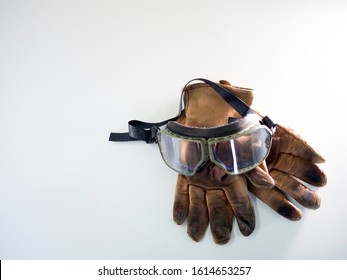 Vintage Goggles And Old Vintage Dirty Motorcycle Gloves
