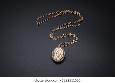 Vintage gold pendant necklace on gold chain, isolated on a  back ground
