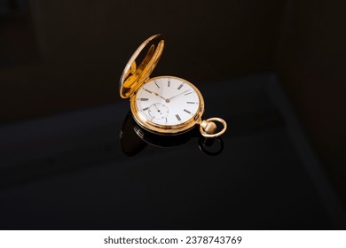 vintage gold pocket watch on black background - Powered by Shutterstock