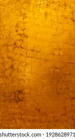 Vintage Golden Background With Matte Paint Texture Of Variation Shades Of Fortuna Gold Color. Metallic Decor On An Old Wall In Vintage Style, Gilded Effect With Stains And Scratches On Surface.