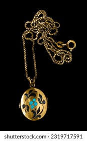 Vintage golden locket necklace isolated on black background