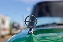 Vintage Green Car With Hood Ornament