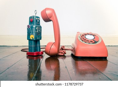 Vintage Grey Robot Toy On The Phone Standing On A Old Wooden Floor 