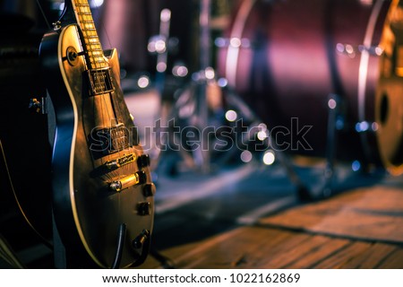 Vintage guitar on stage waiting for his player.
