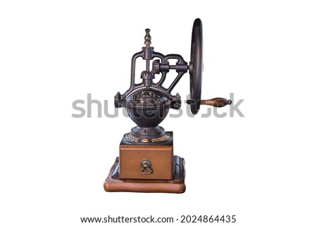 Vintage hand cranked coffee grinder isolated on white backgrounds work with clipping path