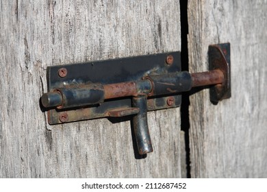 A Vintage Handmade Rusty Sliding Bolt Lock