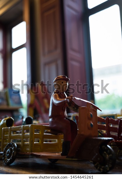 Vintage handmade toy with natural light from\
background window