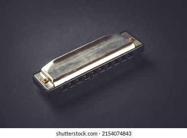 Vintage harmonica isolated on a black background