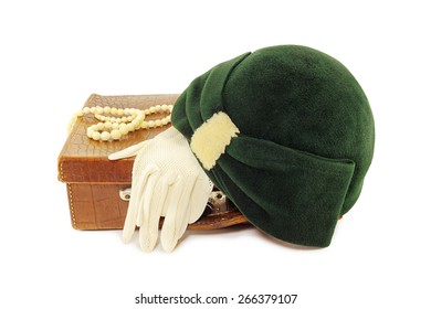 Vintage Hat And Gloves On Leather Bag Isolated On White Background