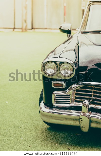 Vintage headlight lamp on vintage classic car -\
vintage filter effect
