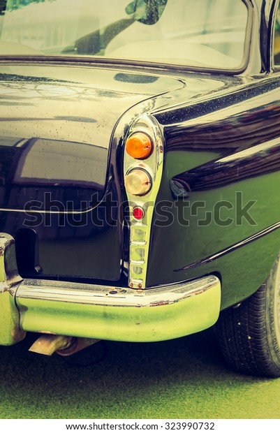 Vintage headlight lamp on vintage classic car -\
vintage filter effect