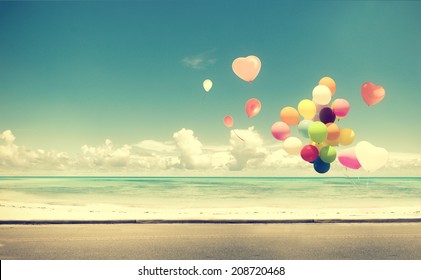 Vintage heart balloon on beach blue sky concept of love in summer and wedding honeymoon - Powered by Shutterstock