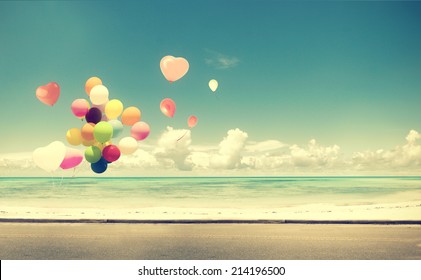 Vintage  heart balloon on beach blue sky concept of love in summer and wedding honeymoon