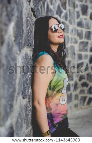 Similar – Woman with sunglasses looking at camera over garden fence