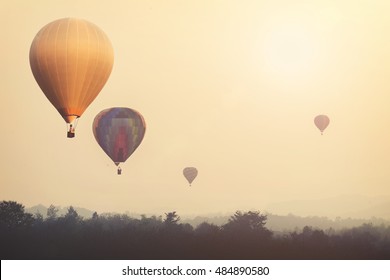 Vintage Hot Air Balloon Flying On Sky With Fog. Photo Vintage Of Travel And Air Transportation -vintage With Retro Filter Effect Style