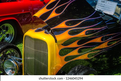 Vintage Hot Rod With Painted Flames At A Car Show