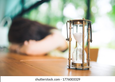 Vintage hourglass.Coronavirus crisis destruction waves, second waves will be worse and disaster critical.Entrepreneur fear and panic.Business woman tired and sadness from COVID-19 coronavirus.