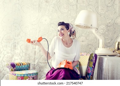 Vintage Housewife Chats On The Phone In Hair Salon