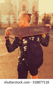 Vintage Image Of A Man With Longboard Going On Road,hipster Young Teen Boy,b-boy,hiker Man,skater Bag,sunset Lights,mans Hairstyle,mans Fashion,urban Street Style,swagger Bag
