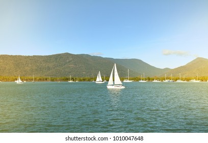 Vintage Image Of Sailing Boats On Trinity Inlet Against Mountains And Blue Sky In Cairns Queensland Australia